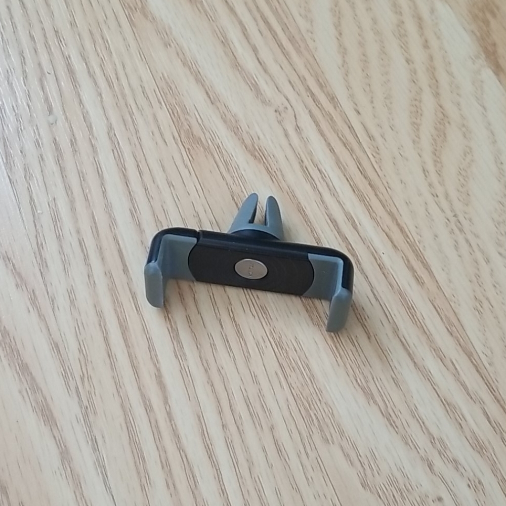 Phone holder for vents in car